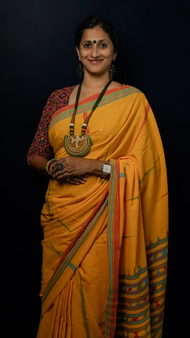 Renu in a mustard Bhujodi saree